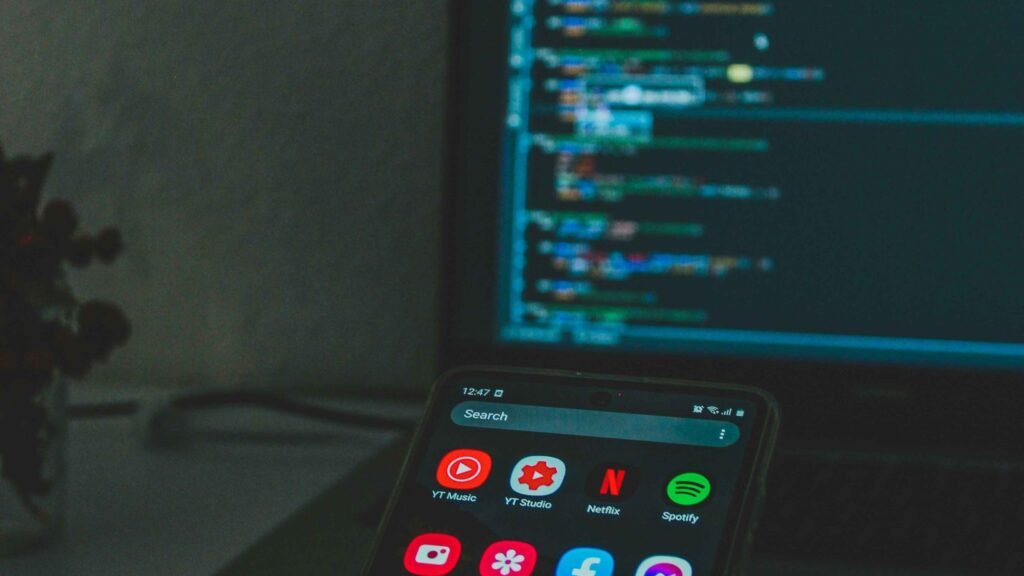 Smartphone screen displaying popular mobile applications illustrating how do apps make money
