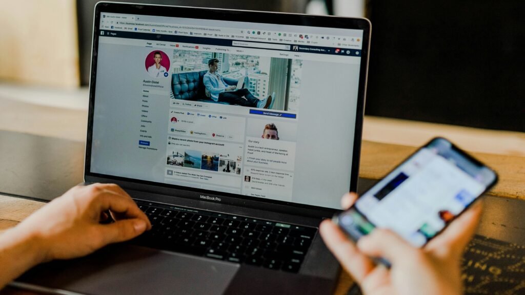 Person working on a laptop and smartphone to promote affiliate content illustrating how to make money with artificial intelligence