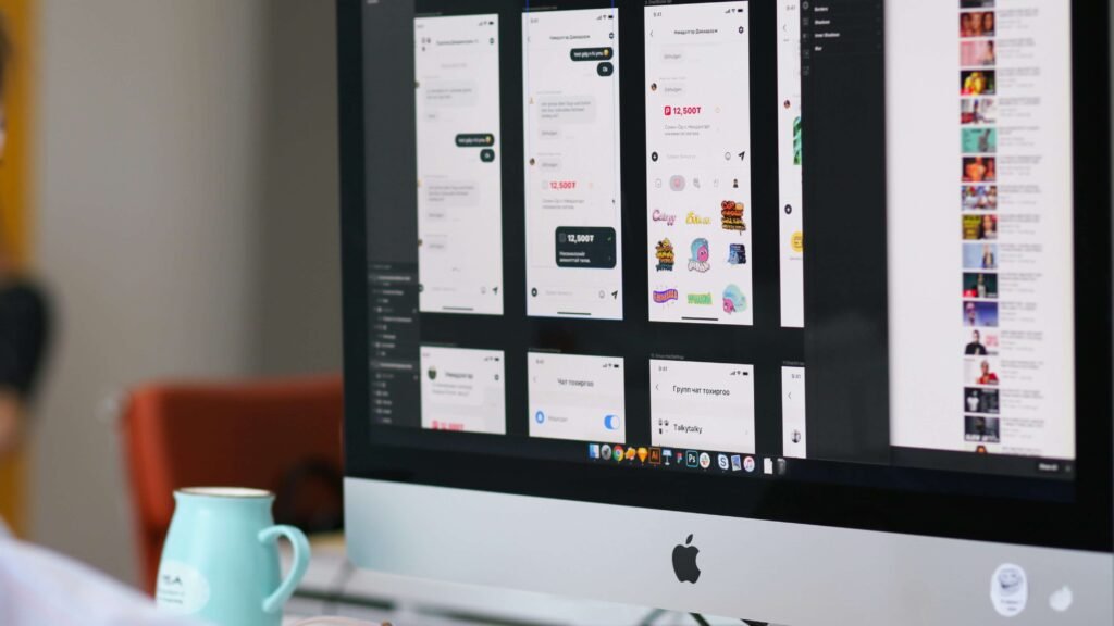 iMac monitor showing app interfaces and digital designs explaining how to make money with artificial intelligence using automation and Art and Design