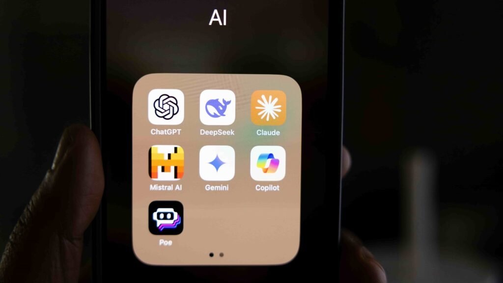 Mobile screen displaying a folder of top AI assistants and tools