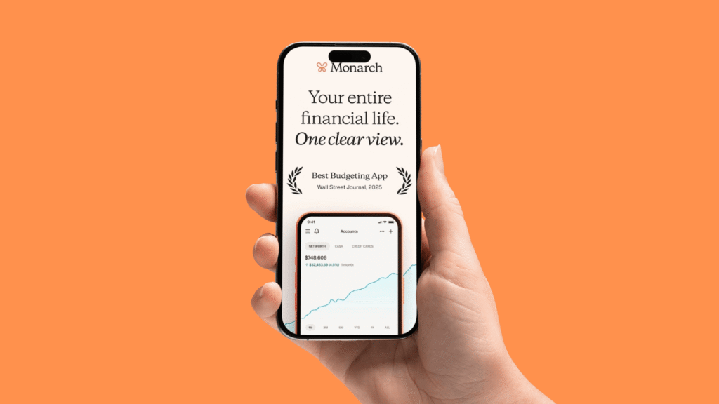 Hand holding a smartphone showing the Monarch app interface as one of the best budgeting apps for couples