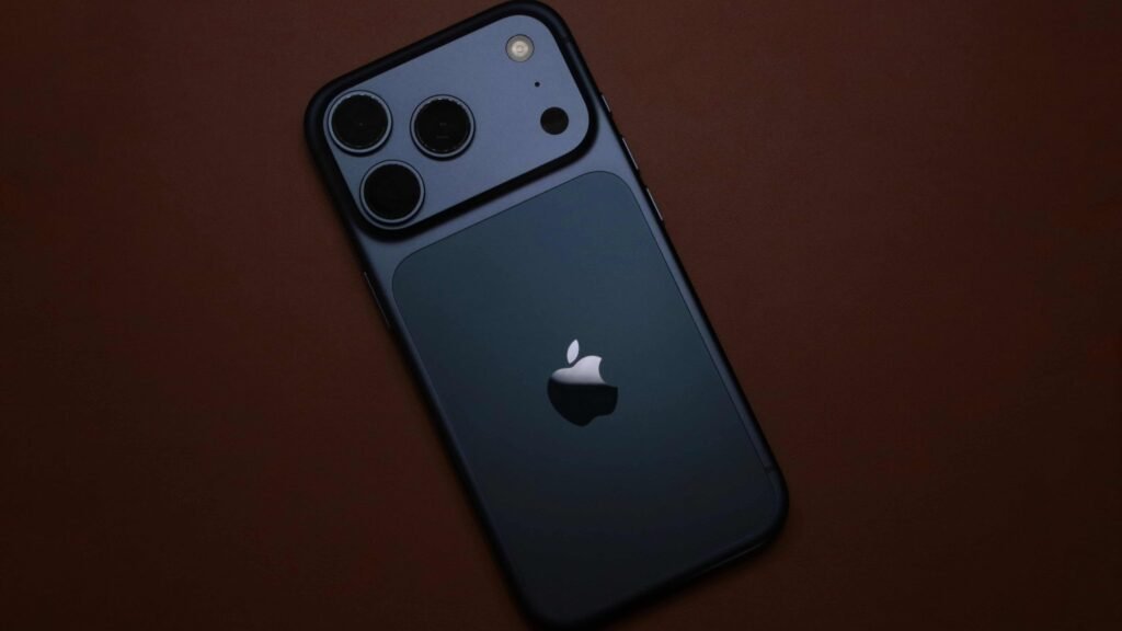 Dark titanium iPhone 18 Pro resting on a surface for when does iphone 18 come out pre-order guide