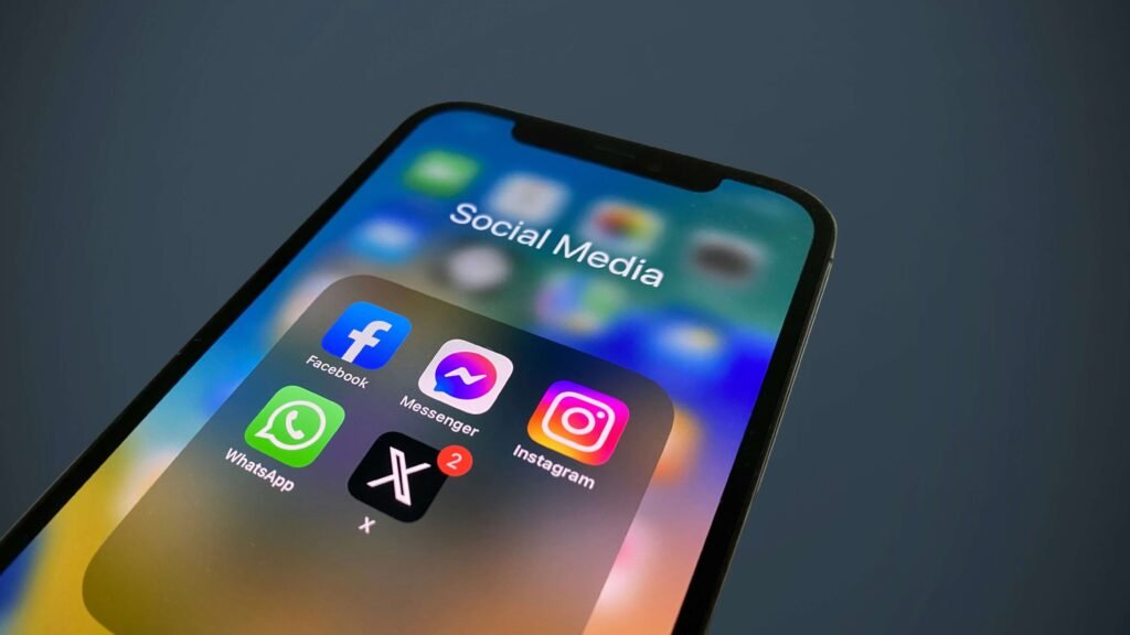 Close-up view of a 'Social Media' folder with app icons including X, relevant for the threads app vs twitter comparison on the surrounding interface.